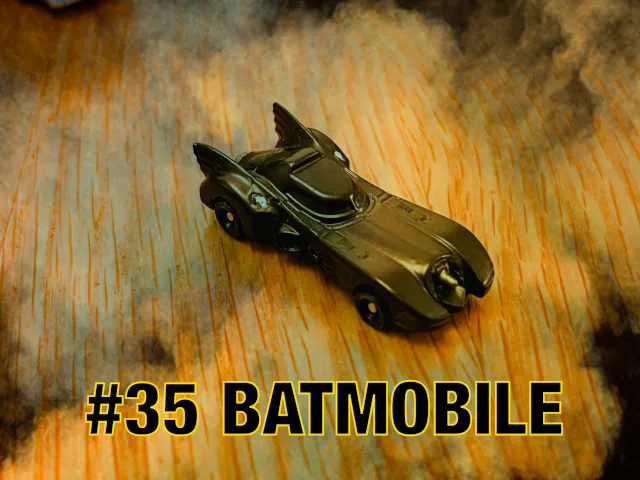 A carousel photo displaying the thirty-fifth vehicle named 'Batmobile' out of an array of 'Deluxe Cars', at full size. This super car is mostly painted black equipped ready for crime solving adventures.